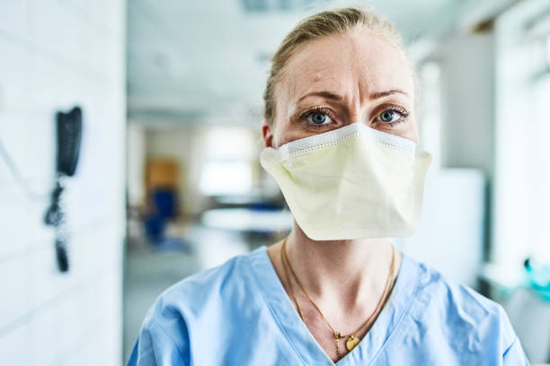 istock Nurse wearing facemask in hospital 1225771251