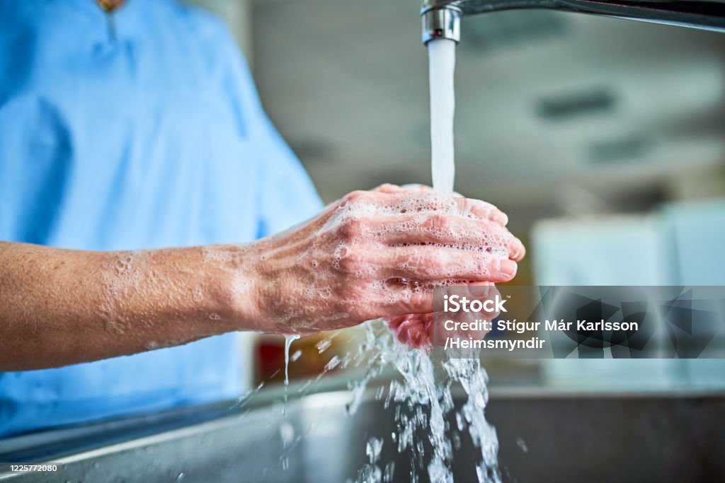doctor washing hands Doctor washing hands during covid-19 Washing Hands Stock Photo