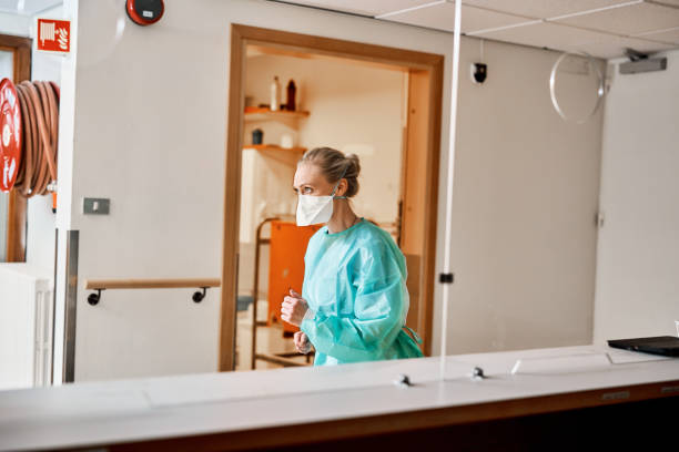 istock Nurse running wearing face mask 1225772348