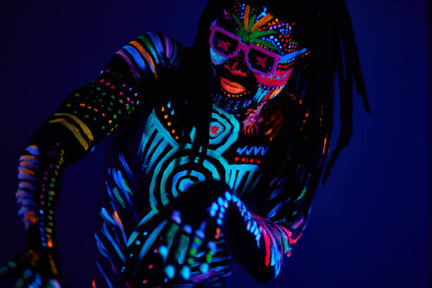 istock cool african man with fluorescent body art dancing isolated 1225773932
