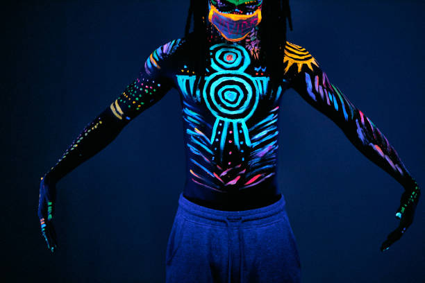 istock young man blur with ultraviolet body art 1225774274