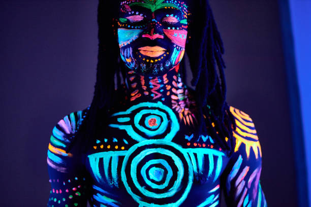 istock handsome guy with UV body art close his eyes 1225774591