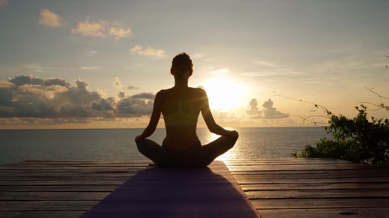 woman sitting in lotus position