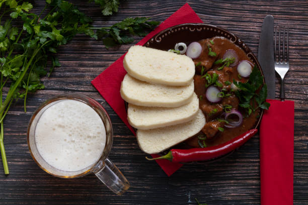 dumplings, goulash, beer, parsley stock photo