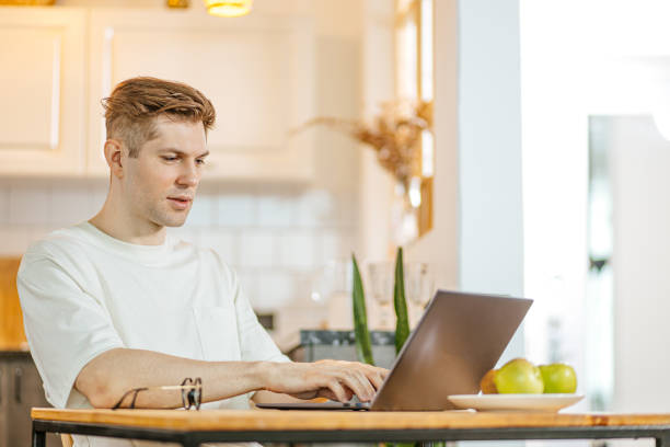 istock young caucasian man work at home 1225777632