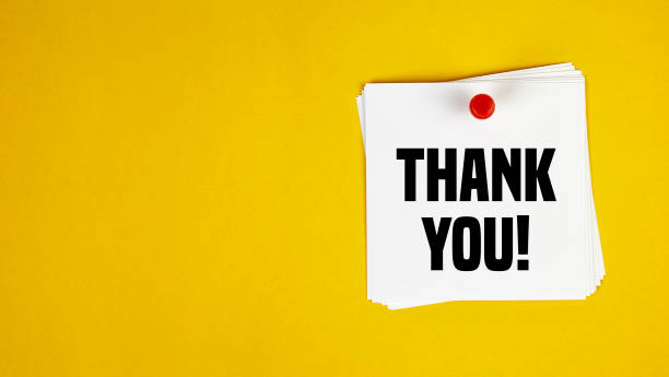 istock Note paper with thank you message on yellow background. 1225778016