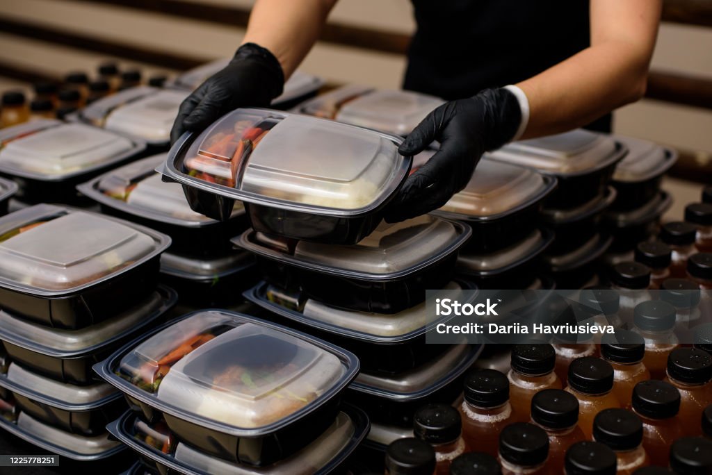 Lunch box with food in the hands. Catering Food Stock Photo