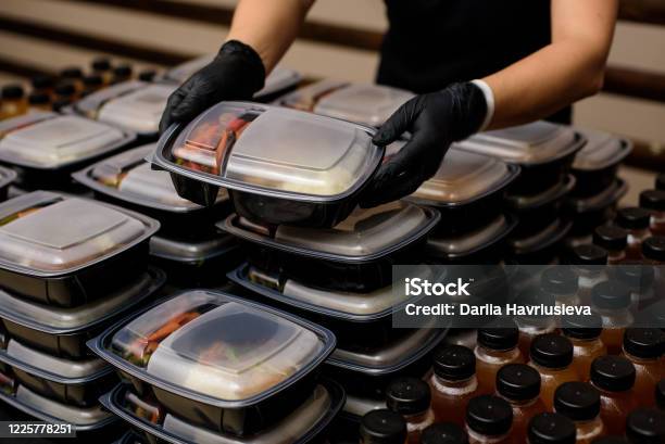 Lunch Box With Food In The Hands Catering Stock Photo - Download Image Now - Food, Delivering, Take Out Food