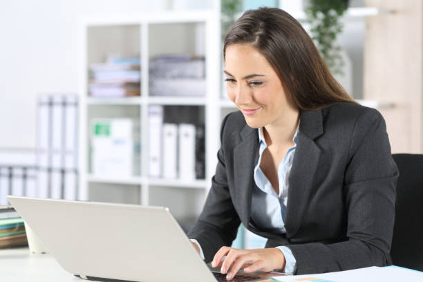 istock Executive woman working on laptop sitting at office 1225780889
