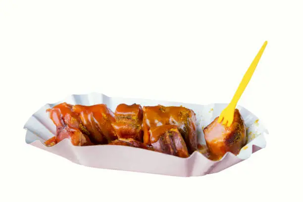 Traditional German streetfood currywurst isolated on white background. Top view