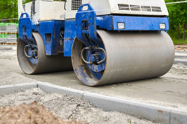 istock Men at work. The construction roller makes the road. Make a new road surface. 1225782894