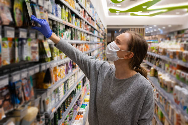 istock Female customer wearing mask and gloves 1225783135