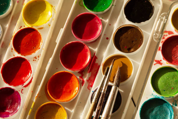 istock Watercolor paints with brushes 1225786156