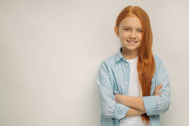 istock positive smiling child with red hair isolated 1225788741