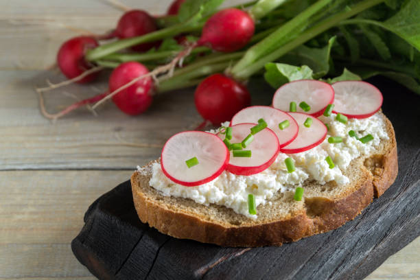 istock Rye bread with butter and radish. 1225789145