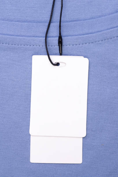 istock Blank price tag with string on blue T-shirt 1225789157
