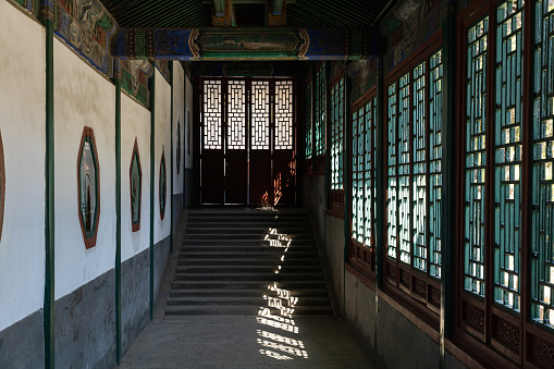 Lijiang, China - April 23, 2014: People visit Mu Residence in the Old Town of Lijiang. The residence reflects the architectural style of China during the Ming and Qing Dynasties.