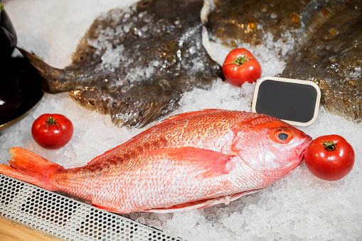 Raw frozen red fish in the fish market