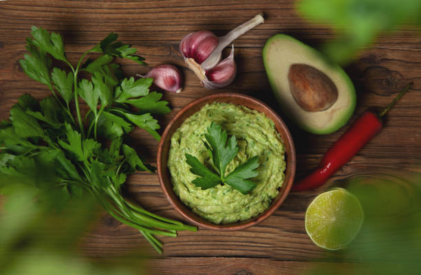 istock guacamole in a wooden bowl 1225790499