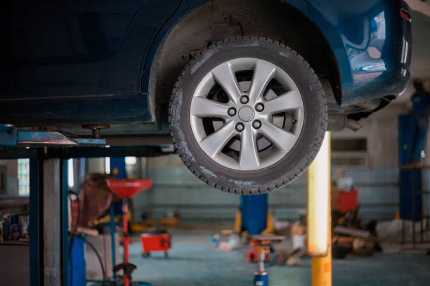 istock Car in auto service lifting for repairing 1225790558