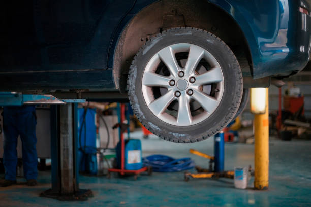 istock Car in auto service lifting for repairing 1225790576