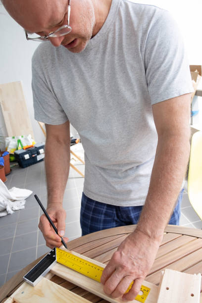 istock Focused serious mature man practicing his carpentry hobby 1225790657