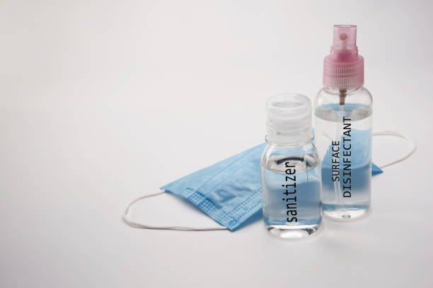 istock hand sanitizer surface disinfectant and face mask 1225797741