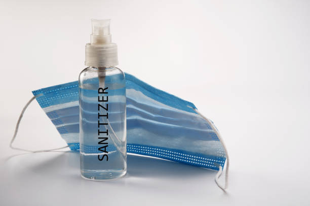 istock hand sanitizer and face mask 1225798344