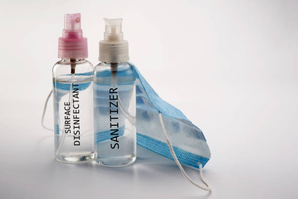 istock hand sanitizer surface disinfectant and face mask 1225798403
