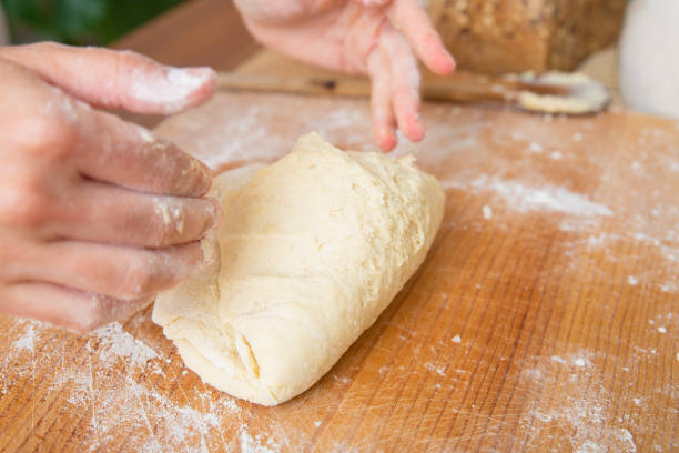 istock Kneaded dough for pastry on wooden board 1225800425