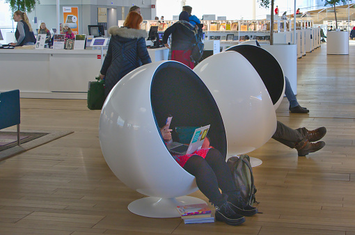 Helsinki, Finland – February 6, 2020: A ball chairs provide a peaceful places to rest Oodi Libray is a popular meeting place in middle of city and has voted for world's best new library in 2019.