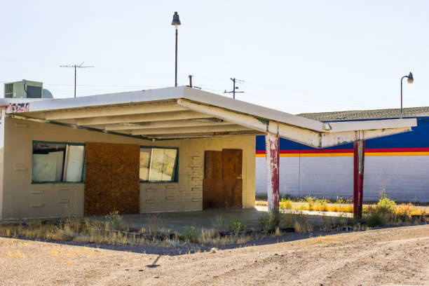 istock Old Commercial Building With Boarded Up Entrances 1225801759