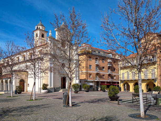 istock Small town square and white church in Alba, Italy. 1225801963
