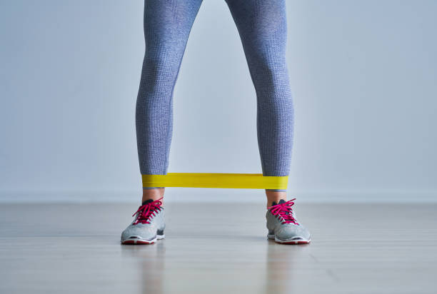 istock Adult woman training alone at home 1225804631