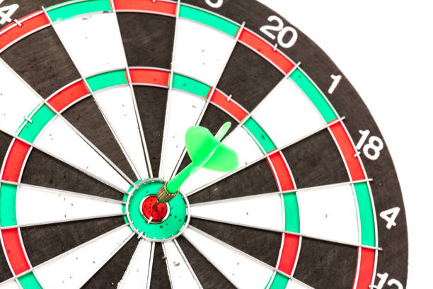 istock Dartboard with darts on white background, closeup. Purpose concept 1225810710