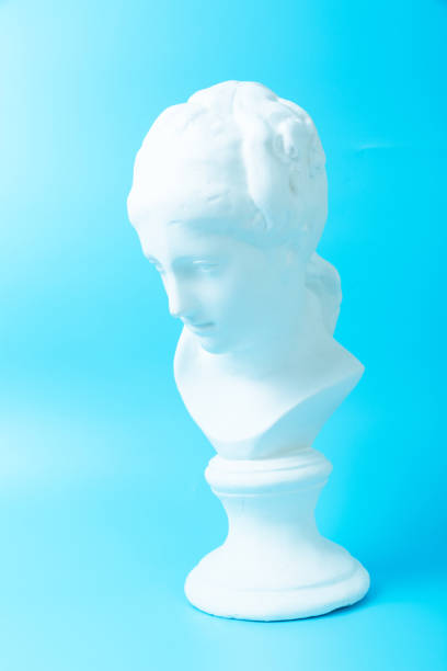 istock Girlish Venus plaster head on blue background 1225813941