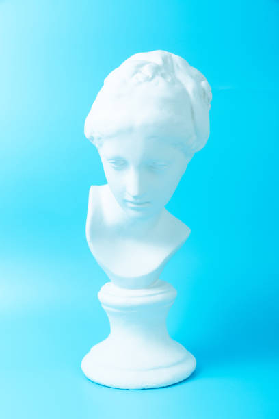istock Girlish Venus plaster head on blue background 1225813951