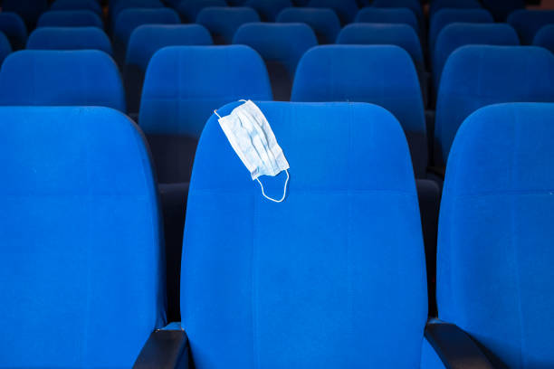istock Protective face mask on a cinema seat 1225814876