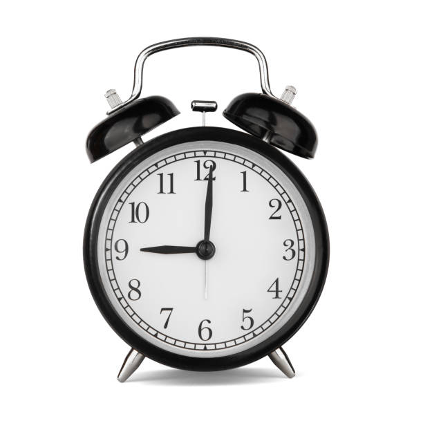 istock Classic round black metal alarm clock isolated on white background. 9 o'clock 1225815729