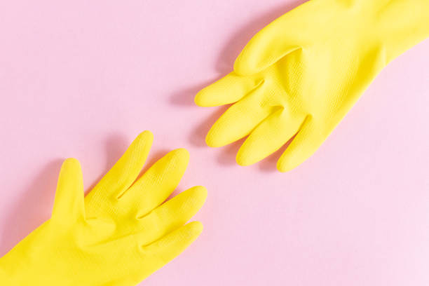 istock Protective yellow hand gloves isolated on pink background 1225816868