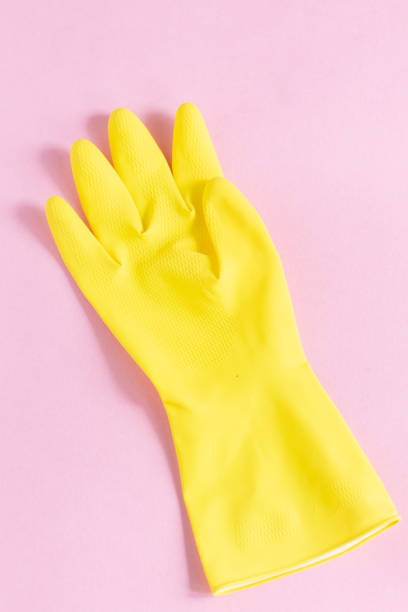 istock Protective yellow hand gloves isolated on pink background 1225816958