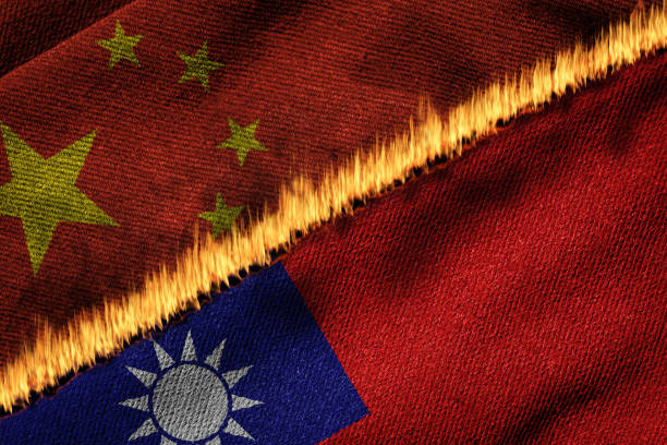 Flags of China and Taiwan on Fire Concept of Political Tension and Conflict Flags of China and Taiwan on fire illustrating the concept of political tension and conflict between the two entities. Dispute over WHO admission following Covid-19 outbreak. taiwanese flag stock pictures, royalty-free photos & images