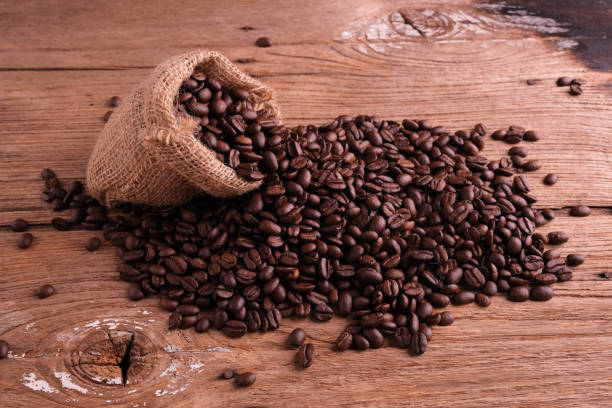 istock coffee beans on old wood background texture 1225821167