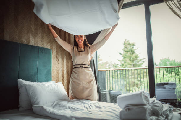 istock Housekeeper making the bed at a hotel 1225821228