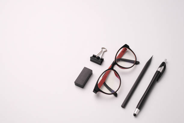 istock office supply top view pen eye glasses on white background 1225821776