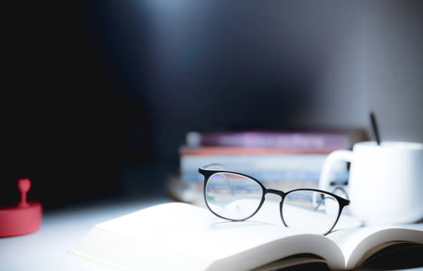 istock Book with cup and glasses stock photo 1225821870