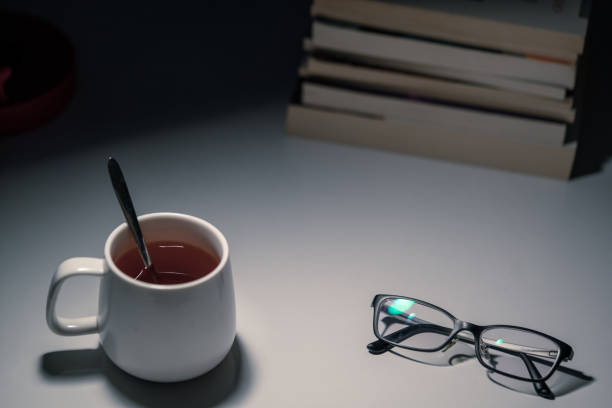 istock Book with cup and glasses stock photo 1225821884