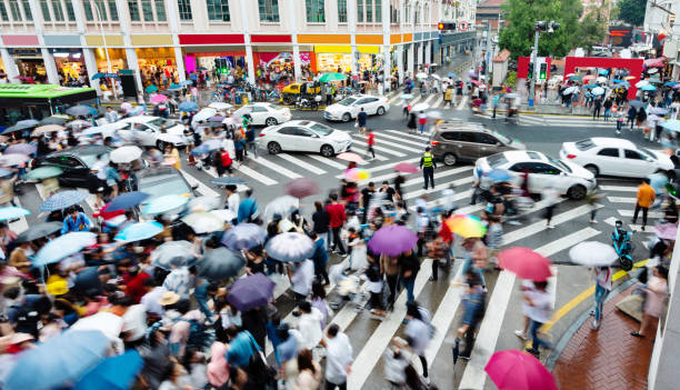 istock Motion blurred people and cars on the sidewalk 1225823631
