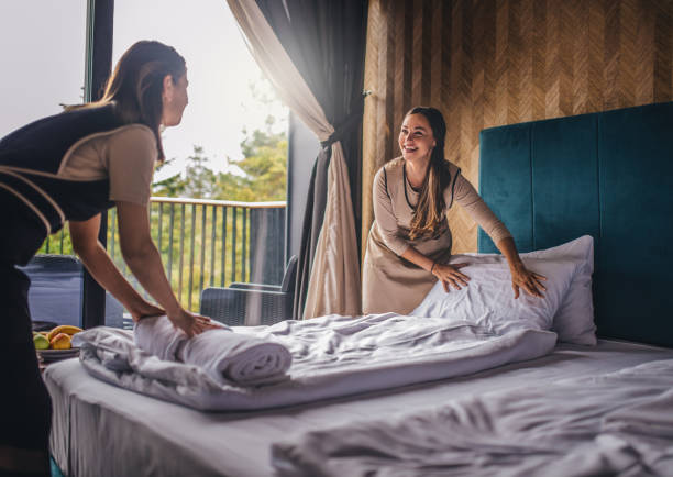 istock Housekeeper making the bed at a hotel 1225823838