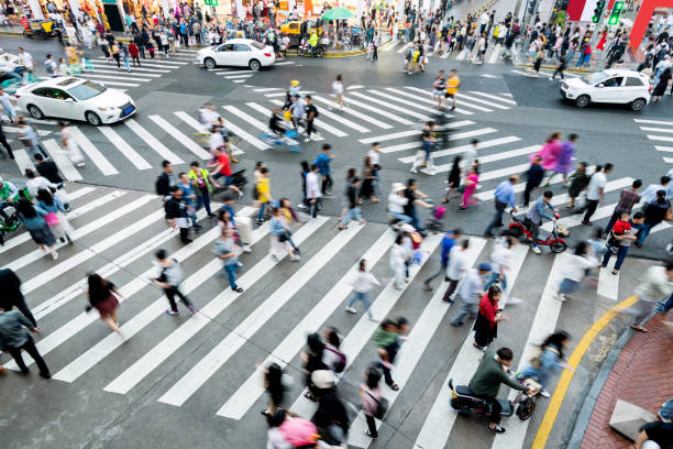istock Motion blurred crowd of people walking on crosswalk 1225824910